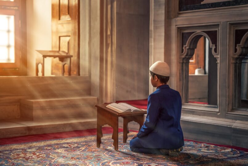 A boy reading Quran