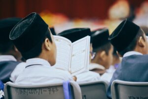 Kid reading Quran